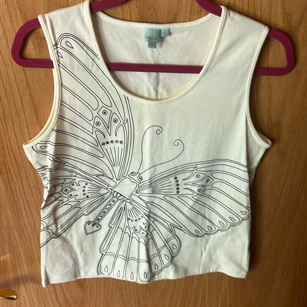 Cream colored tank with butterfly